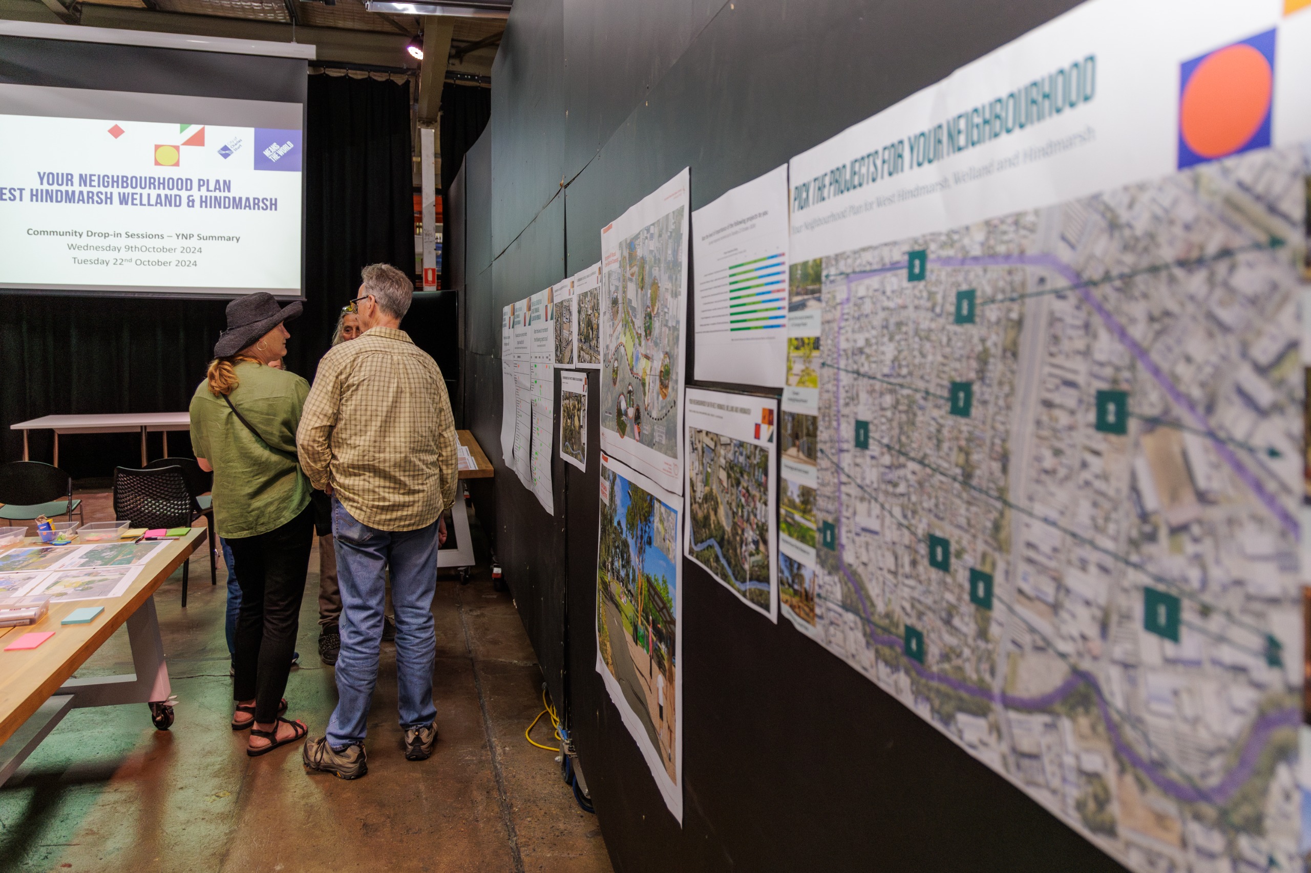 people talking at a community drop-in event
