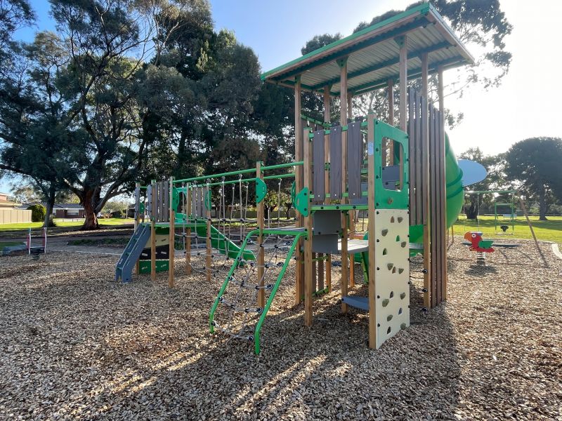 Image of recently renewed Wilford Reserve Playground play structure with rock climbing slides and brigde.