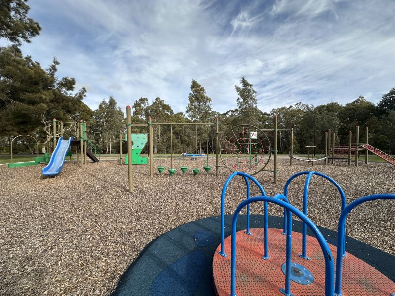 Image of play structure, spinner, robe climb & standing swing